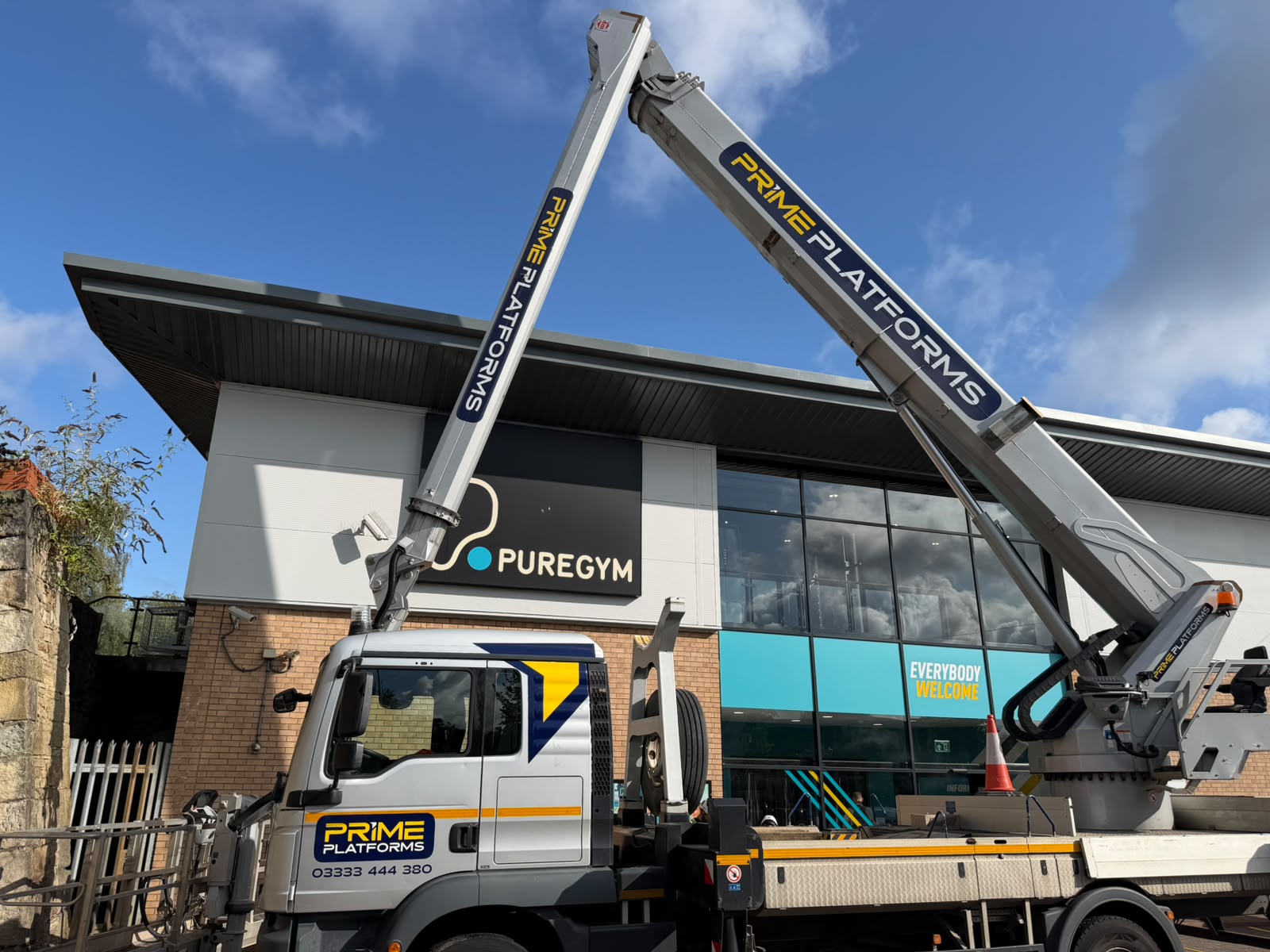 Prime Platforms truck mounted platform set up outside a gym building