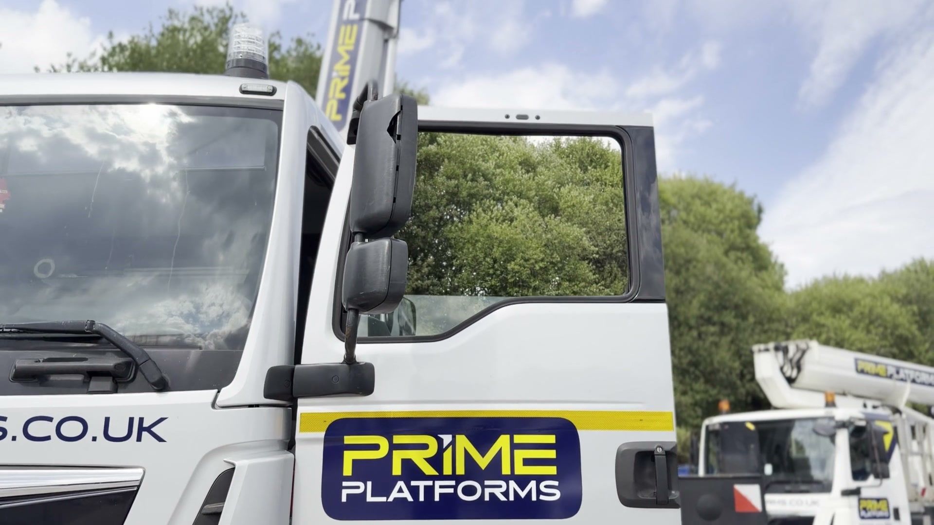 Prime Platforms truck mounted platforms lined up in the yard